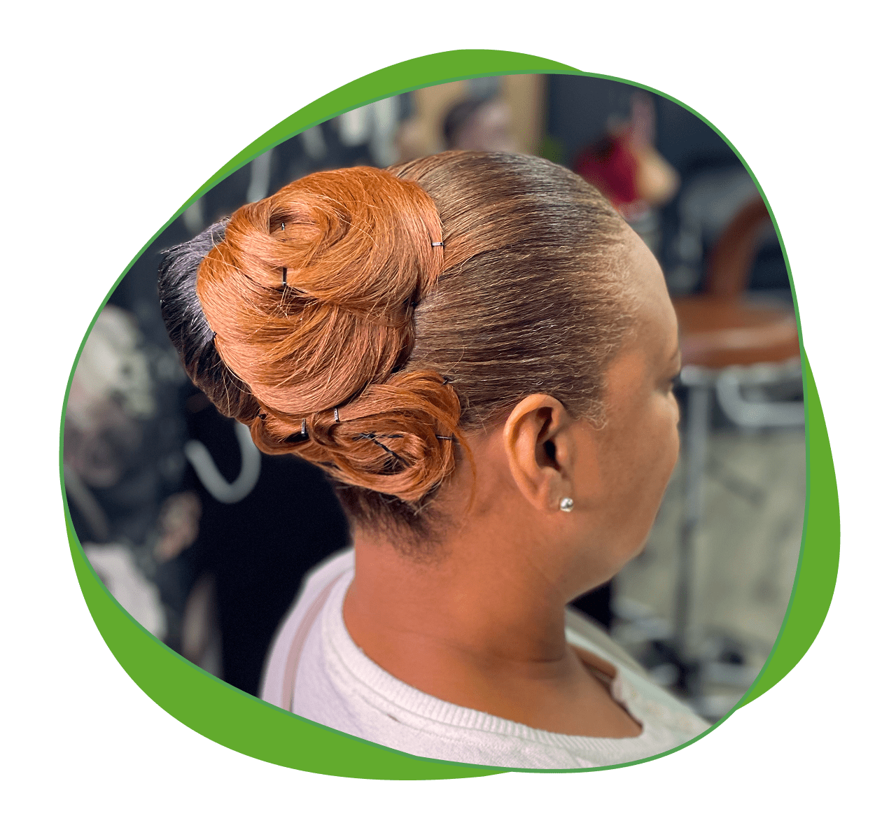 Elegant updo hairstyle with intricate rose-shaped bun detail.
